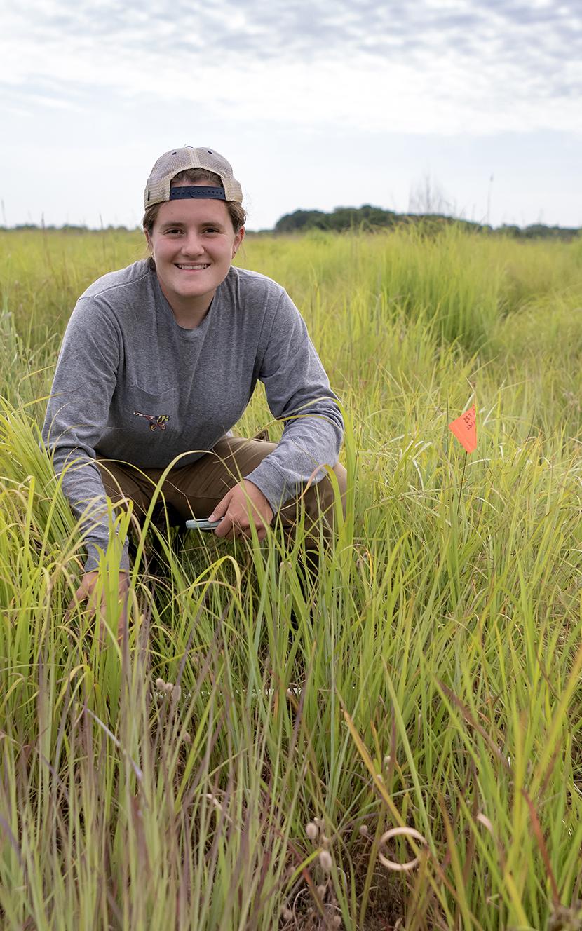 Danielle Simmons in a grassland at the River and Field Campus